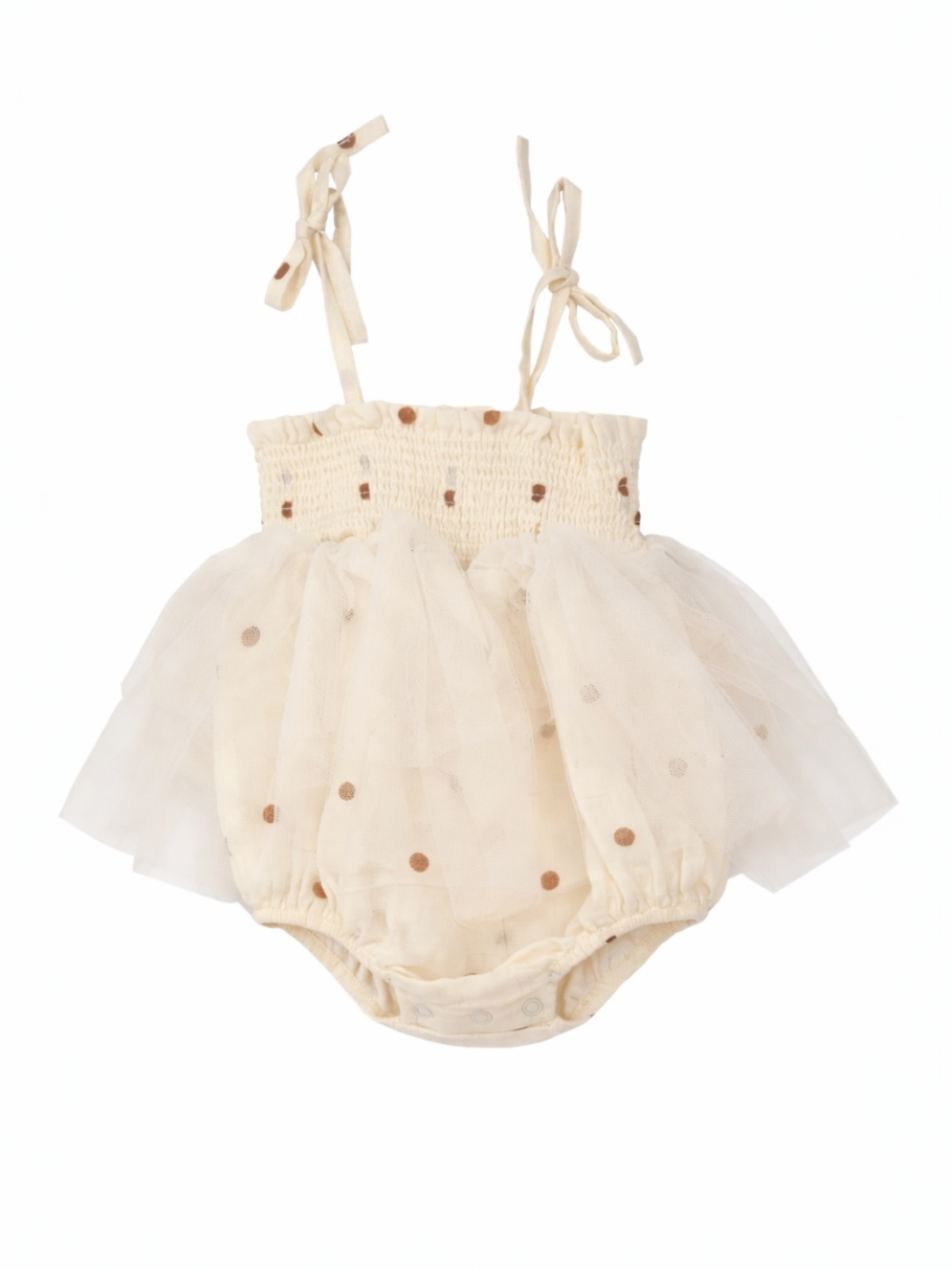 Cream-colored baby dress with polka dots and tulle skirt, featuring adjustable straps for a snug fit.