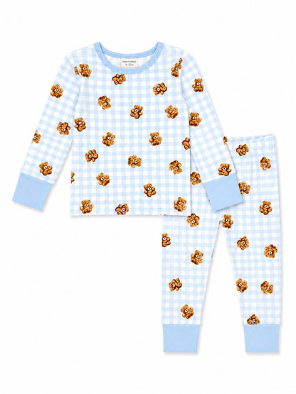 Blue gingham pajama set for infants featuring cute teddy bear motifs. Long sleeves and matching pants included.