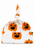 White knot hat featuring playful orange pumpkin faces with smiling expressions. Perfect for Halloween celebrations.