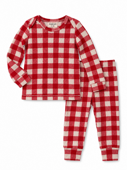 Red and white checkered pajama set for infants, featuring long sleeves and matching pants.