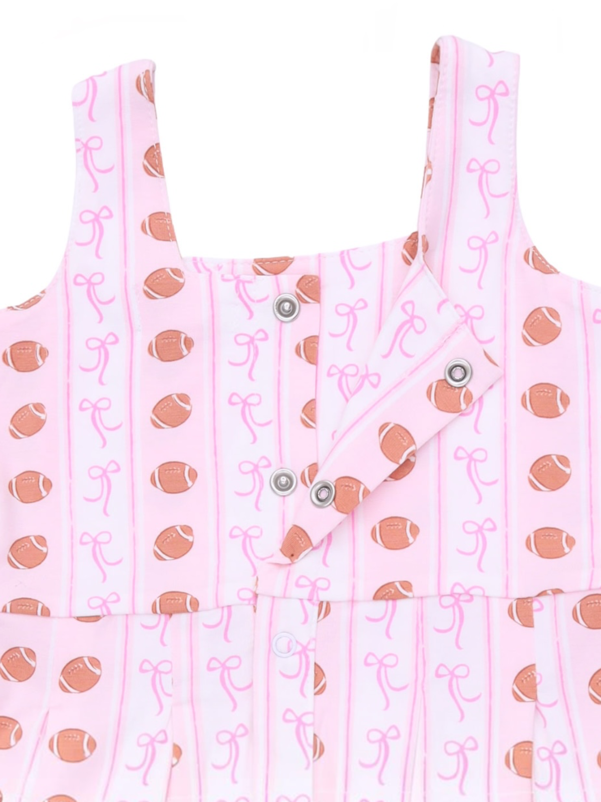 Pink dress featuring a fun football and bow pattern with snap buttons for easy wear.