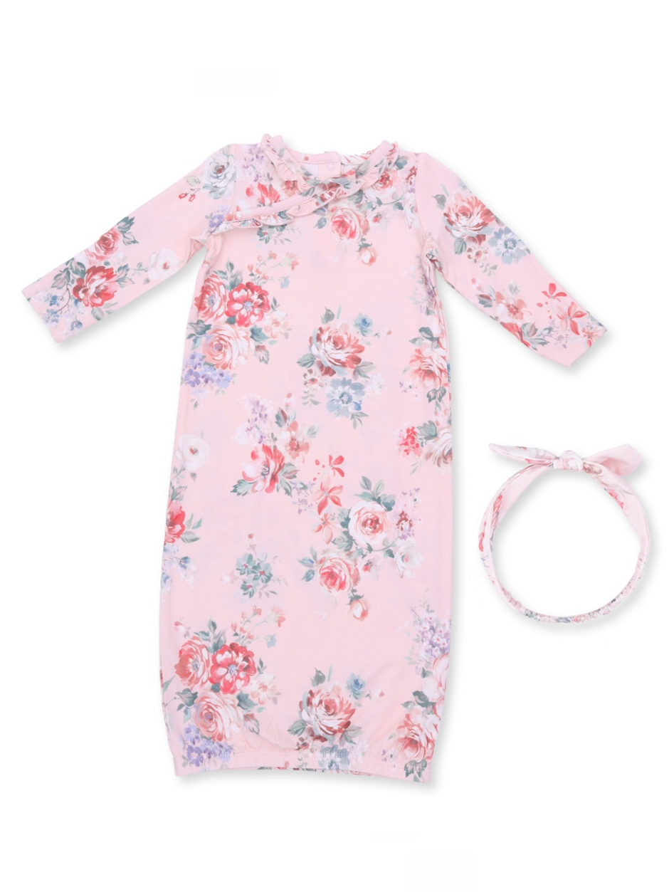 Pink floral baby gown with long sleeves and matching headband. Perfect for infants’ comfort and style.