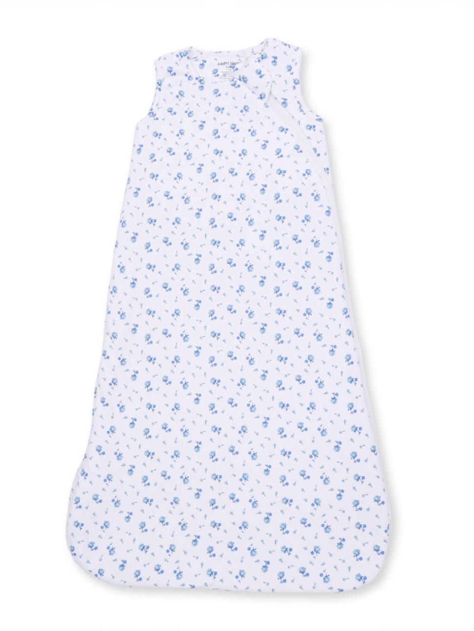 Sleeveless baby sleep sack with blue floral pattern on a white background.