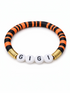 Colorful beaded bracelet featuring black, orange, and gold accents with the name "GIGI" displayed prominently.