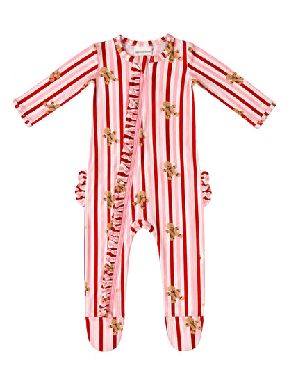 Red and white striped onesie with gingerbread patterns and ruffle detailing. Ideal for cozy playtime.