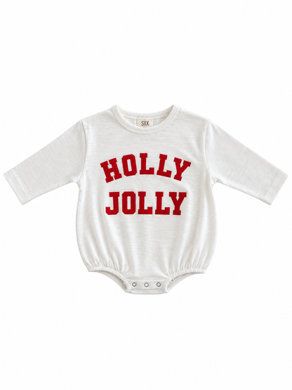 White baby onesie with "HOLLY JOLLY" printed in red letters. Suitable for festive occasions.