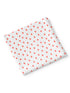 A folded fabric square with a white background and red strawberry pattern.