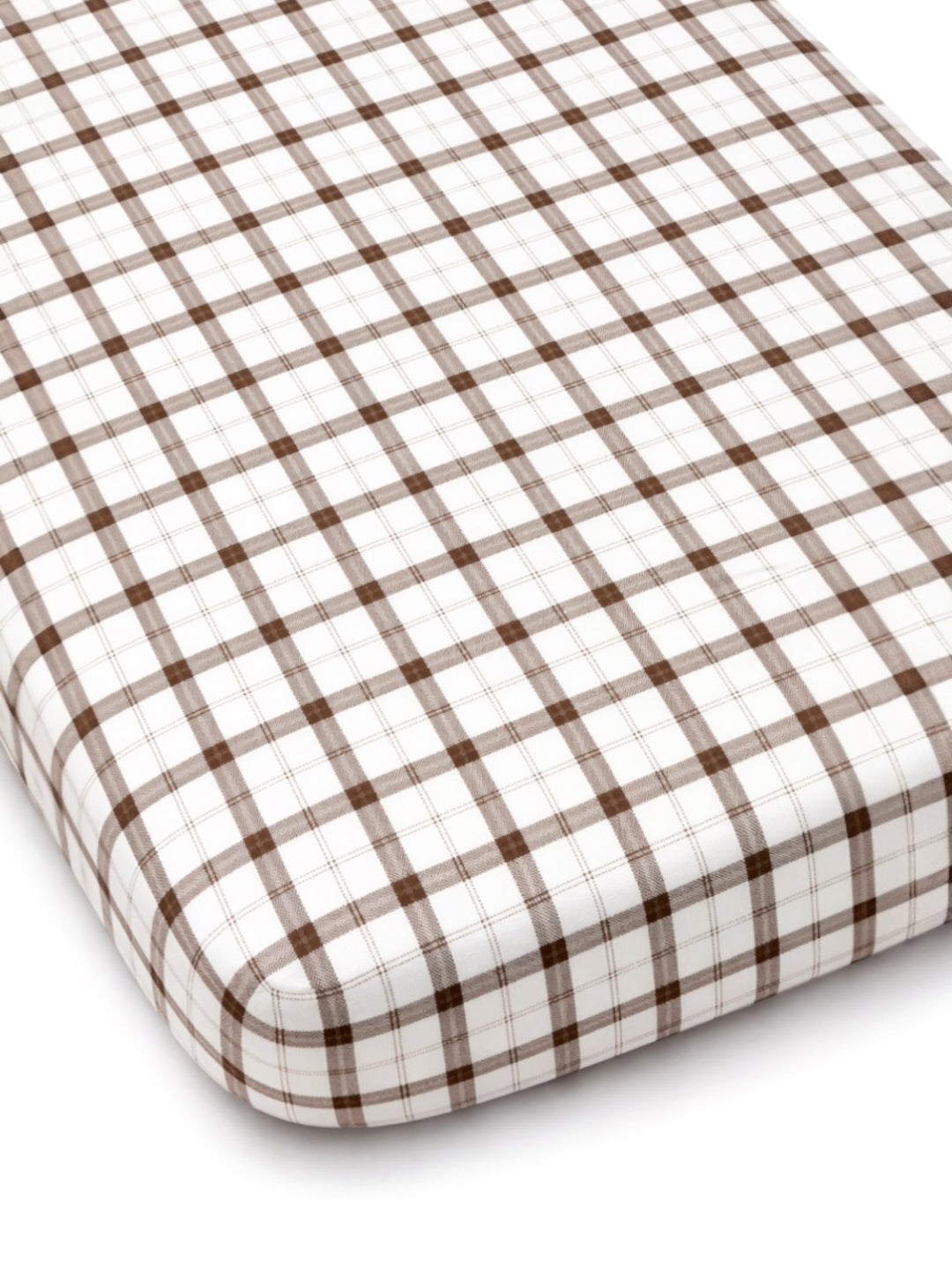 Brown and white plaid crib mattress with rounded edges.