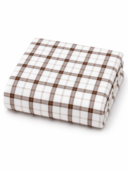Brown and white plaid folded sheet set on a white background. Ideal for cozy bedroom decor.