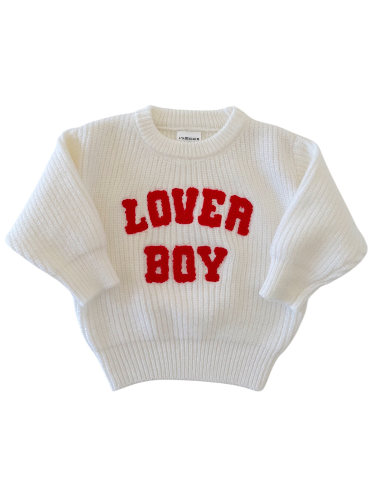 White knitted sweater with red "LOVER BOY" text on the front, featuring a cozy, oversized fit.