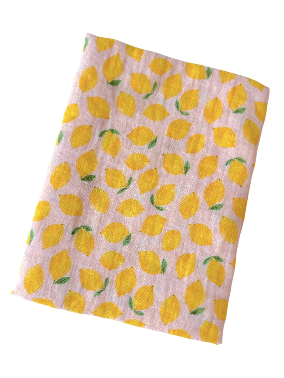 A folded fabric displaying a repeating yellow lemon pattern on a pink background.
