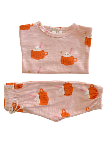 Cozy pink pajama set featuring fun prints of mugs with whipped cream and straws.