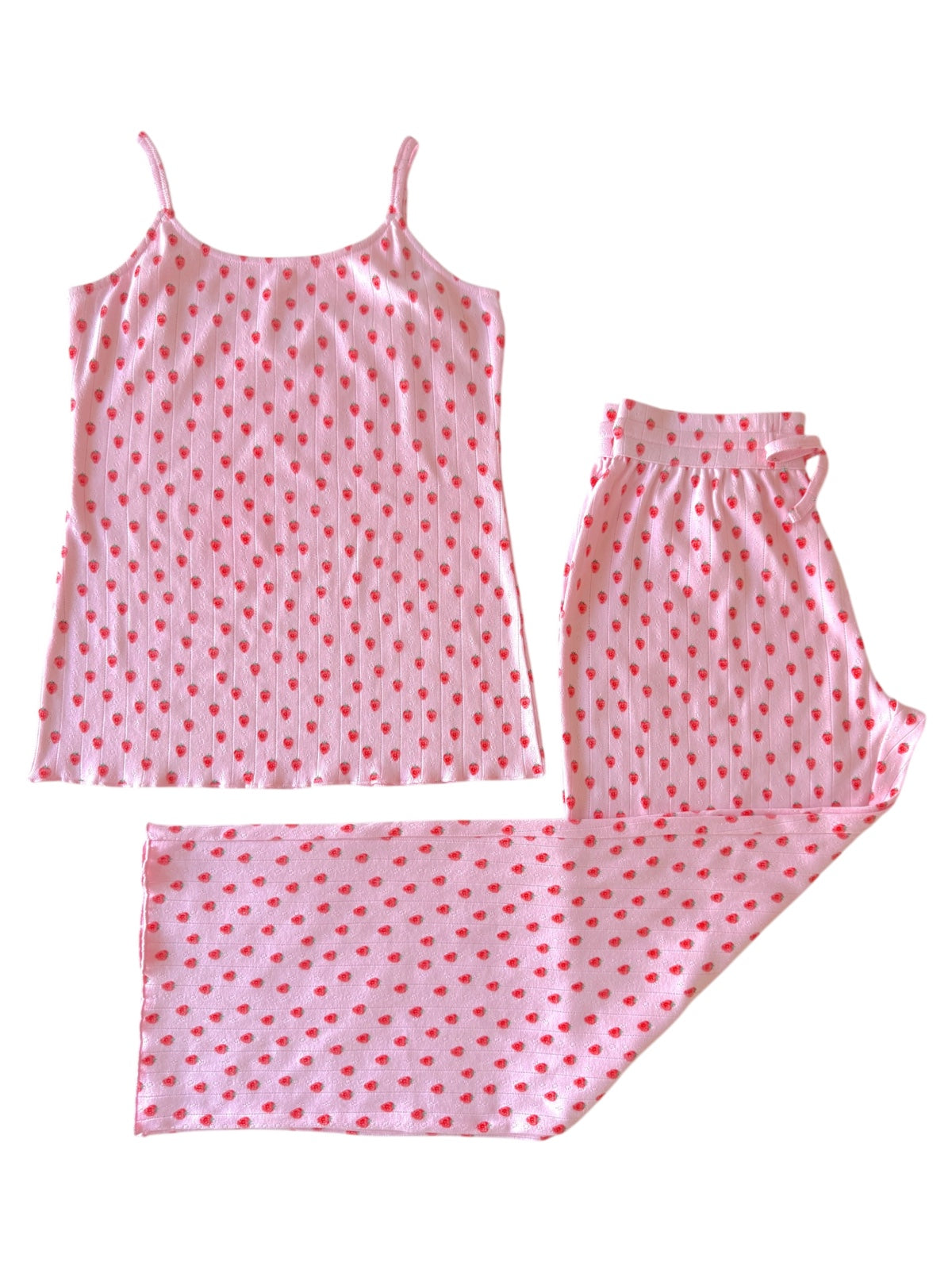 Pink sleepwear set featuring a camisole and pants with red dot pattern.