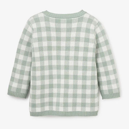 Light green and white checkered sweater, viewed from the back, featuring long sleeves and a rounded neckline.
