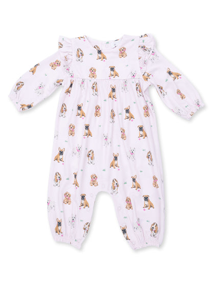 Light pink onesie with various dog prints, featuring long sleeves and ruffle details. Perfect for infants.