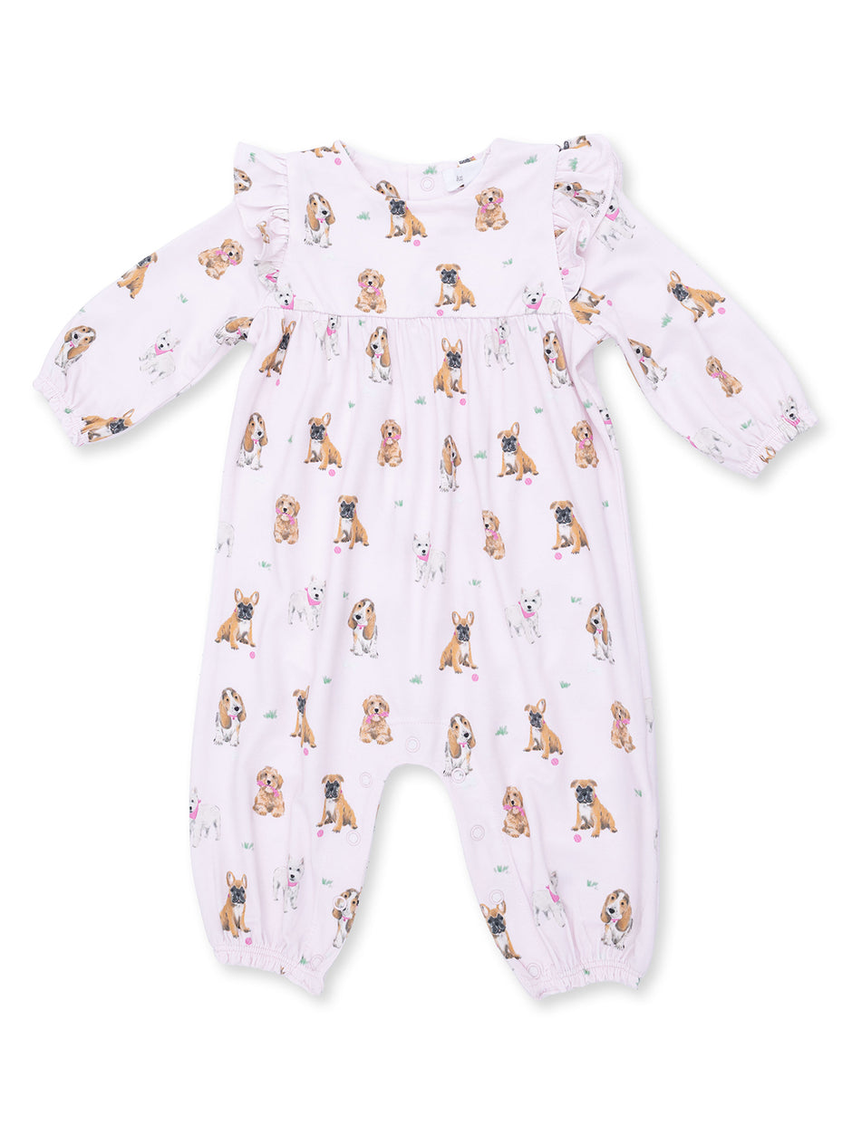 Light pink onesie with various dog prints, featuring long sleeves and ruffle details. Perfect for infants.