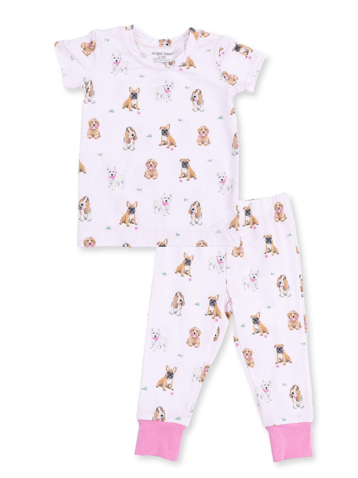 Kids' pajama set featuring a playful dog print on a white background with pink accents.