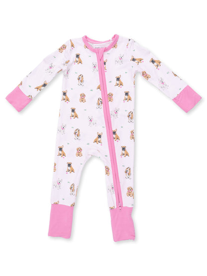 Pink and white dog-patterned onesie with long sleeves and a front zipper. Perfect for kids' sleepwear.