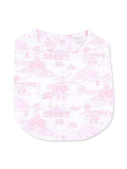 Pink baby bib with a whimsical outdoor scene printed in light pink. Soft fabric, ideal for mealtime.