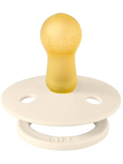 BIBS pacifier with a yellow latex nipple and a white silicone shield, designed for infants and toddlers.