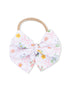 Floral patterned hair bow with a beige elastic band for hair accessories.