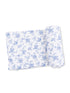 Floral-patterned fabric with light blue flowers on a white background, displayed flat and rolled.