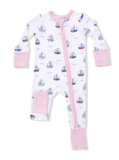 White pajama onesie with pink accents, featuring a sailboat pattern and zip front closure. Perfect for kids.