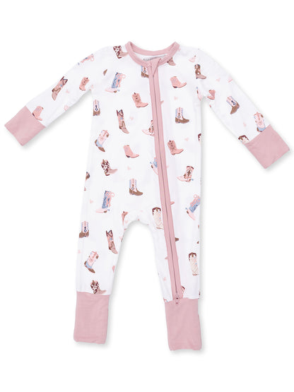 White onesie pajama with pink accents, featuring a playful cowboy boot pattern and a front zipper.