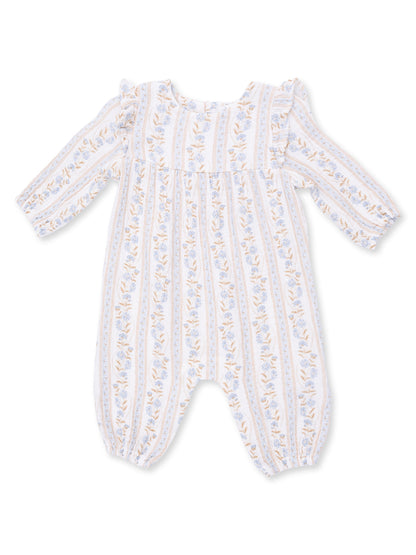 Floral patterned baby romper with long sleeves and ruffled shoulders in soft colors.