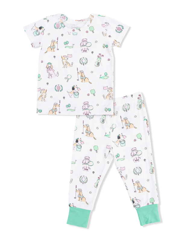 Children's pajama set featuring playful dog prints, including golf, ice cream, and balloons on a white background.