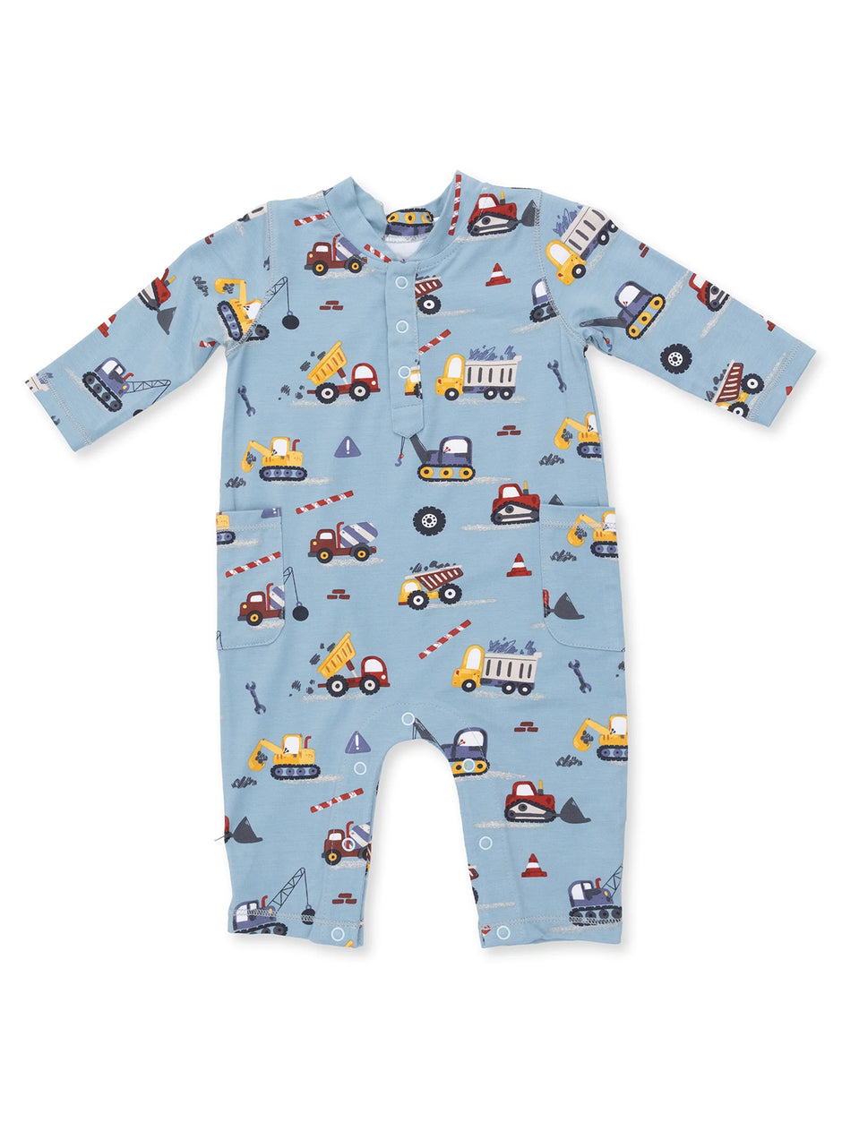 Blue baby romper with playful construction vehicle print, featuring long sleeves and button closure. Perfect for toddlers.
