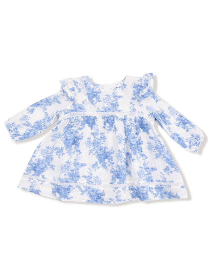 White dress with blue floral pattern and ruffled sleeves, perfect for spring or summer wear.