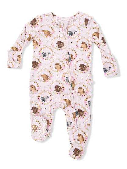 Pink baby pajamas with animal prints and footed design, featuring dogs and floral accents. Ideal for infants.