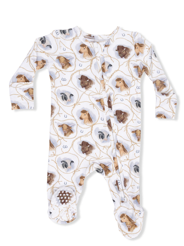 White baby onesie with animal prints, featuring horses, cows, and goats on a natural background.