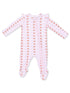 Light pink baby onesie with ruffled shoulders and a playful pattern of brown acorns and pink bows.
