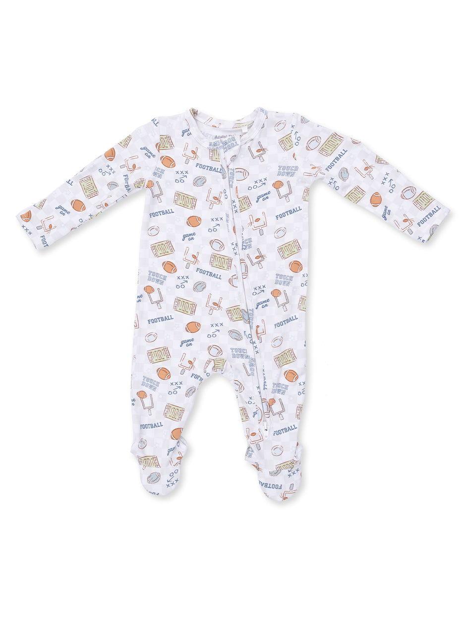 White baby onesie with colorful football-themed prints, featuring balls, helmets, and game elements.