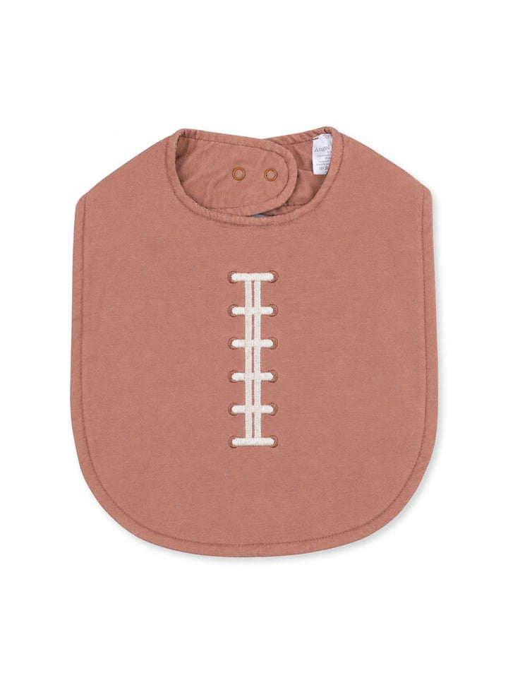 Pink baby bib with a football stitch design, featuring a snap closure at the neck. Ideal for mealtime.