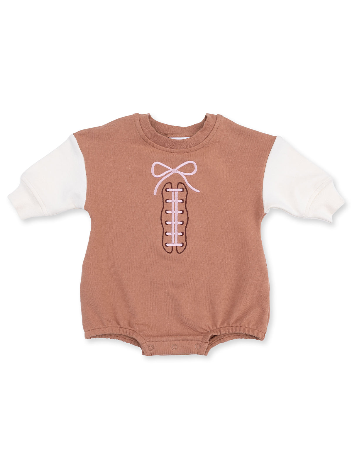 Brown baby onesie with white sleeves and a pink bow design resembling shoelaces.