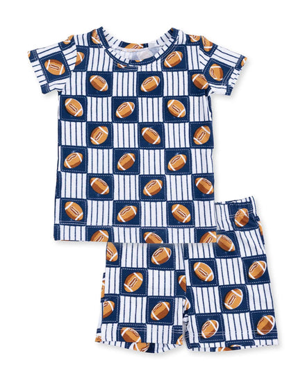 Boys' pajama set with football pattern, featuring a short-sleeve top and shorts in navy and white.