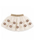 Cream-colored tutu skirt with football patterns and gold bows along the hem. Perfect for sports-themed occasions.