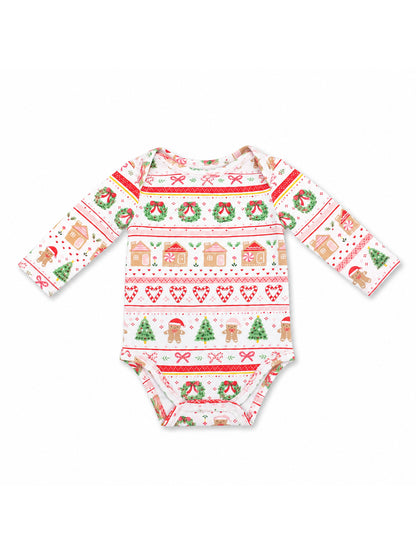 Baby onesie with festive Christmas patterns including gingerbread, trees, wreaths, and candy canes.