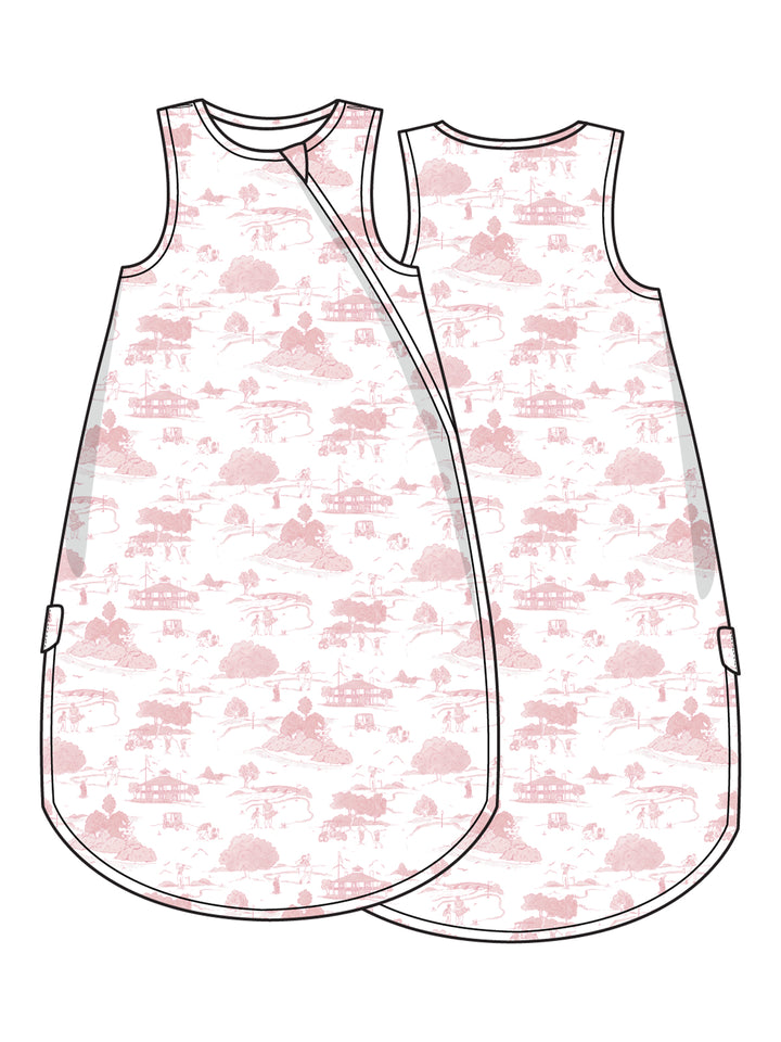 Illustration of a sleeveless baby sleep sack featuring a pastel pink countryside landscape design.