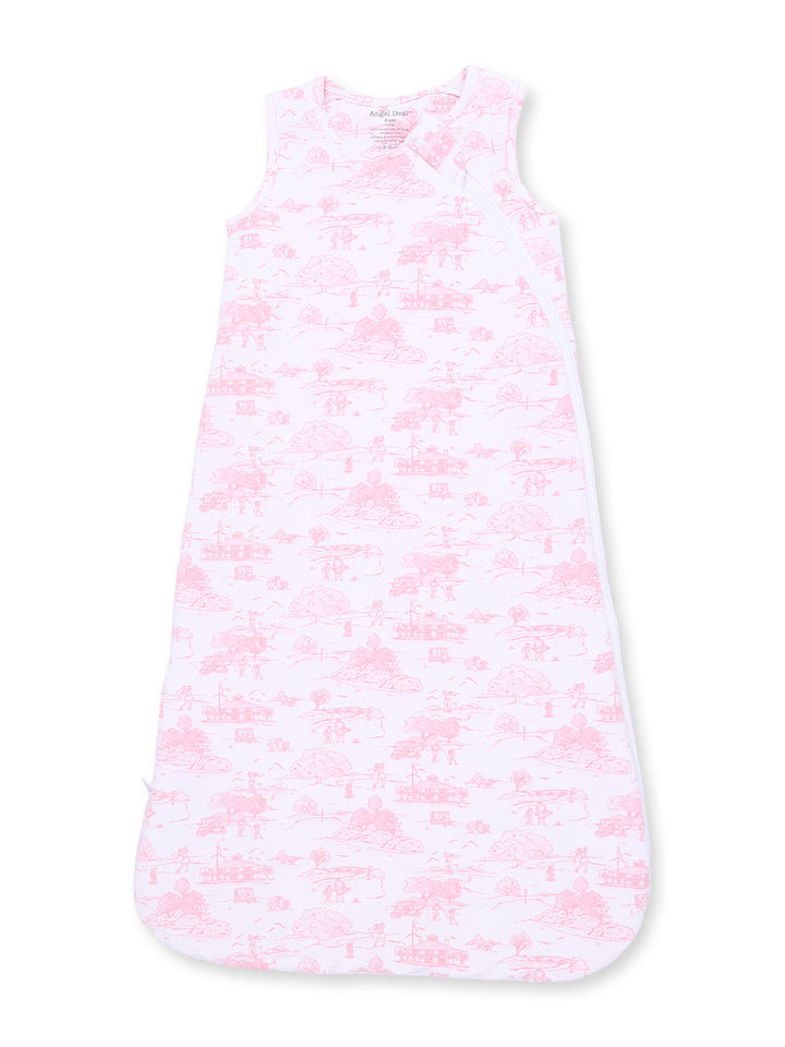 Light pink baby sleeping bag with whimsical nature patterns and sleeveless design.