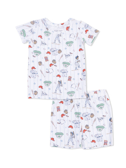 Kids' baseball-themed pajama set featuring short sleeves and shorts with playful graphics of sports equipment.