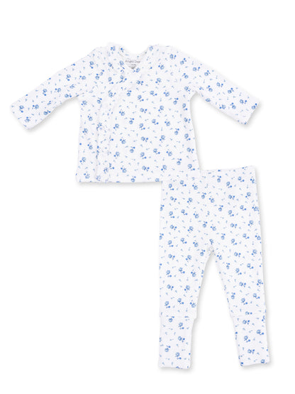 Floral-patterned baby pajama set in white with blue flowers, featuring a long-sleeve top and matching pants.