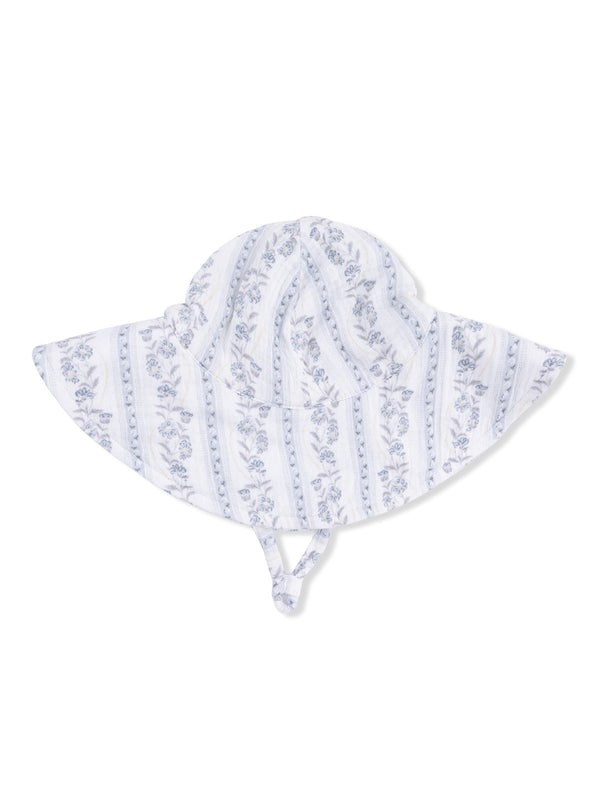 Floral patterned wide-brim hat with ties, ideal for sun protection.