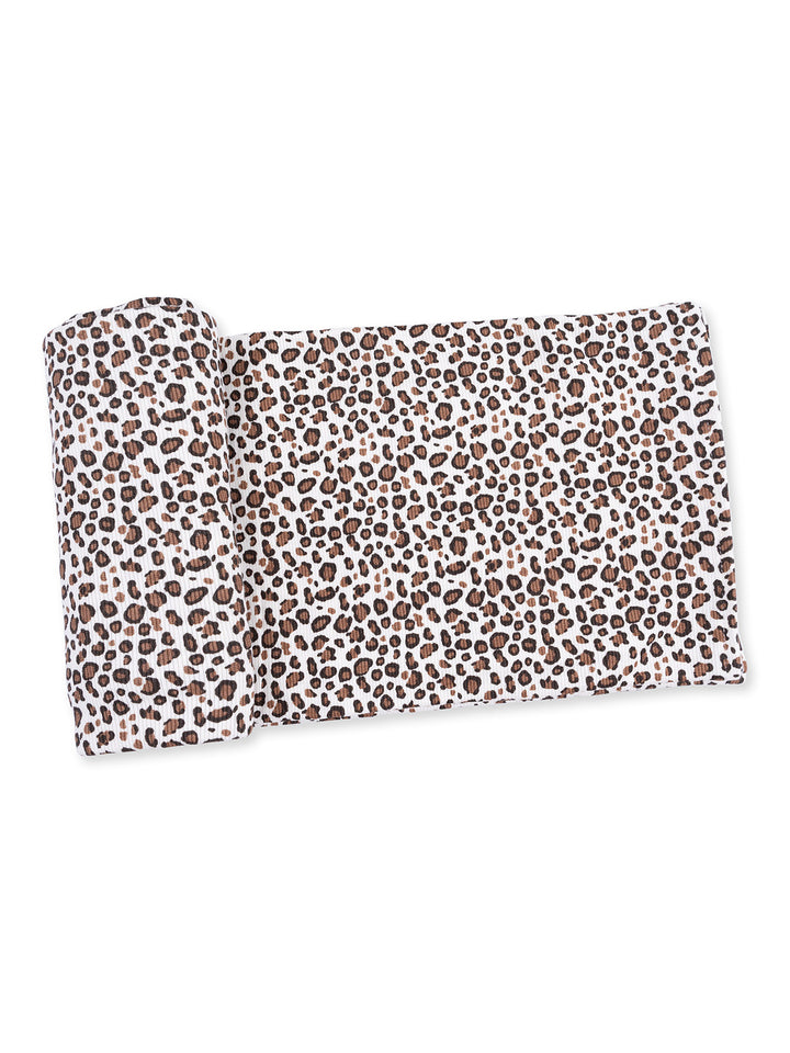 Leopard print fabric roll featuring brown spots on a white background, measuring approximately 60 inches long.