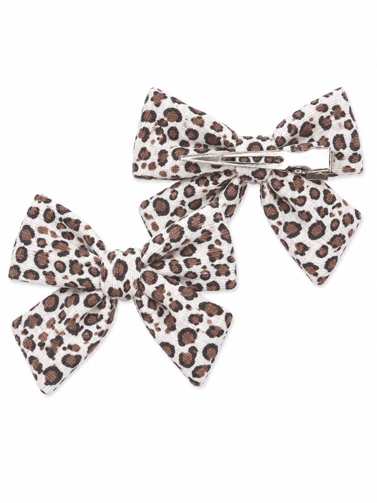 Pair of leopard print hair bows in white and brown, one with a clip and one without.