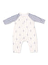 Light-colored baby romper with gray sleeves and a lightning bolt pattern. Perfect for stylish infant wear.