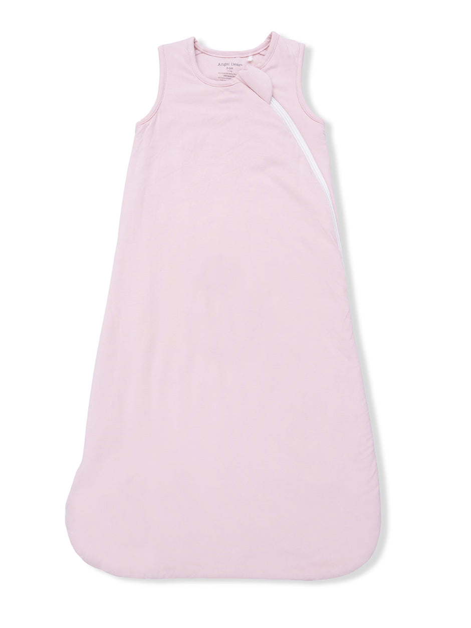 Light pink sleeveless baby sleeping bag with a side zipper and a decorative knot. Suitable for infants.